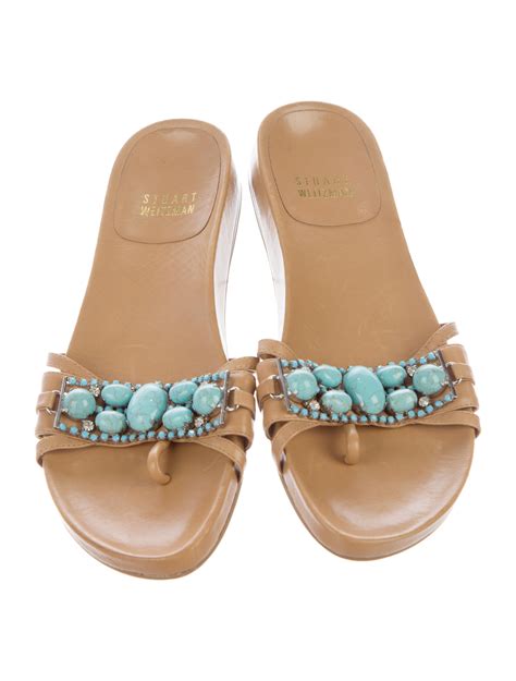 sandals with turquoise stone embellishments.